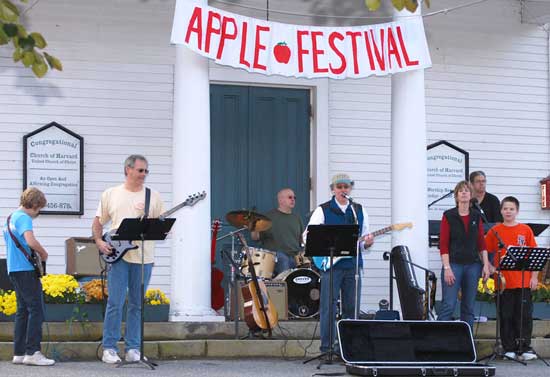 Music fills the air from the Congregational Church. From left: Nick Robinson, Greg Schmidt, Dave Kilkenny, Rob Authier, Sharon Schmidt, Phil Robinson, and Jon Schmidt. (Photo by Darcy Robinson)